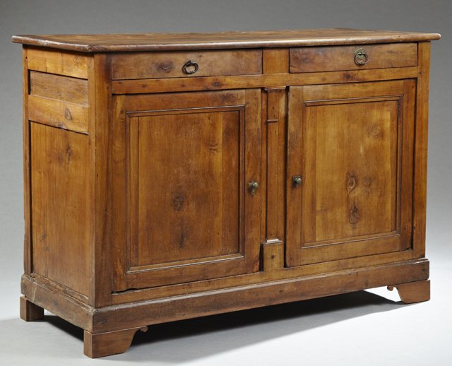 French Louis Philippe Carved Cherry Sideboard, c. 1830,: French Louis Philippe Carved Cherry Sideboard, c. 1830, the rectangular top over two frieze drawers above double cupboard doors on a plinth base on ogee bracket feet, H.- 43 in., W.- 62 1/2 in., D.- 2