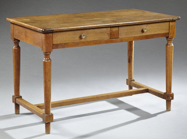 French Louis Philippe Carved Oak Writing Table, 19th: French Louis Philippe Carved Oak Writing Table, 19th c., the rectangular top over two frieze drawers, on turned tapered legs to French toes, joined by an H-form stretcher, branded "B A Etampes" on ski