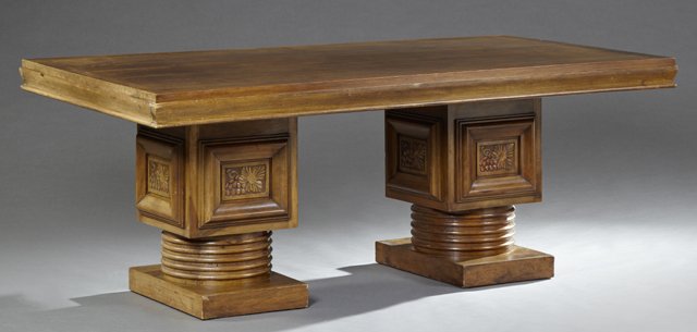 French Art Deco Carved Walnut Banquet Draw Leaf Table,: French Art Deco Carved Walnut Banquet Draw Leaf Table, early 20th c., the stepped edge top over a wide skirt, on double pedestals to a ring turned socle on a square plinth, matching next lots, Closed-