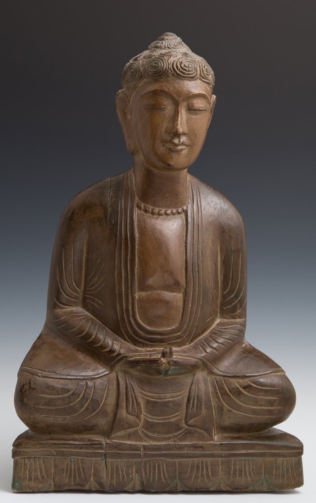 Oriental Carved Wooden Seated Buddha, 20th c., in brown: Oriental Carved Wooden Seated Buddha, 20th c., in brown paint decoration with traces of original green paint, H.- 17 in., W.- 11 in., D.- 5 3/8 in.