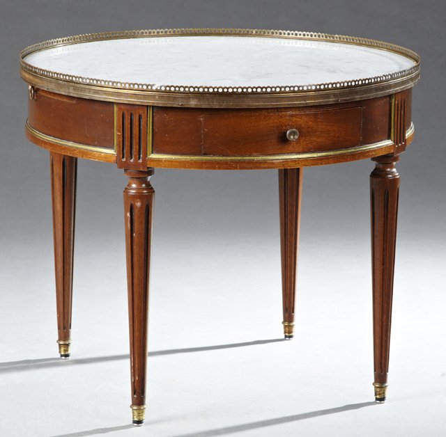 French Louis XVI Style Ormolu Mounted Mahogany Marble: French Louis XVI Style Ormolu Mounted Mahogany Marble Top Bouillotte Style Table, 20th c., the brass galleried inset highly figured white marble over a brass mounted wide skirt with two drawers and tw