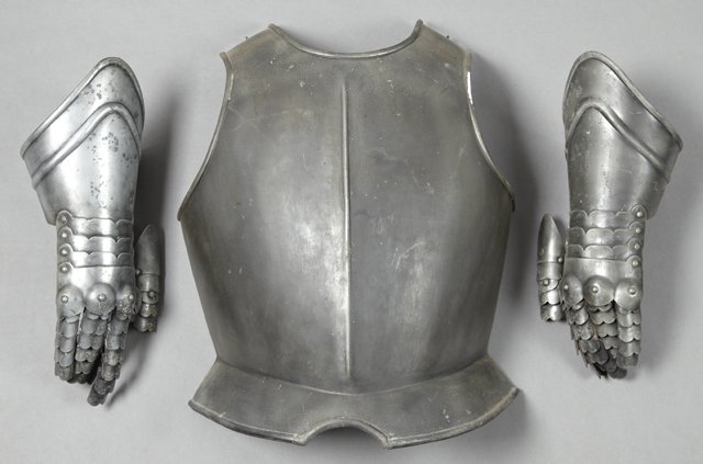Three Pieces of French Armor, 19th c., consisting of a: Three Pieces of French Armor, 19th c., consisting of a pair of gauntlets and a breast plate, Breast Plate- H.- 19 in., W.- 15 in., D.- 8 in.