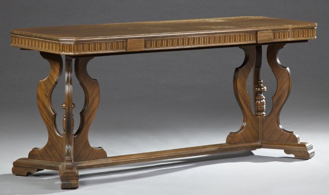 American Carved Mahogany Library or Dining Table, early: American Carved Mahogany Library or Dining Table, early 20th c., the canted corner rectangular top over a wide skirt, with two long drop down leaves, on pierced serpentine pedestals, on bracket feet j