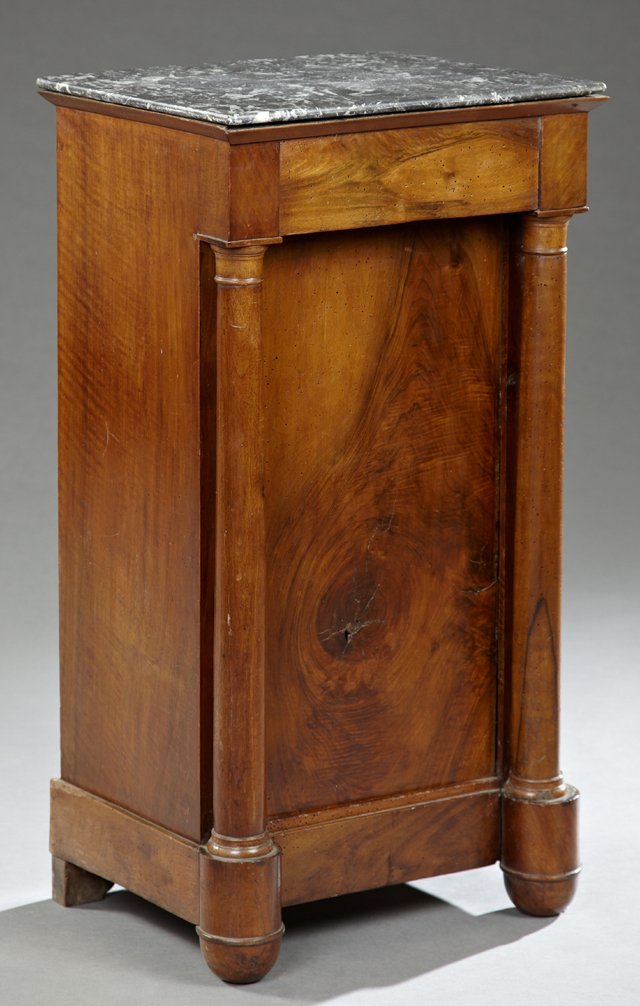French Empire Carved Walnut Marble Top Nightstand, 19th: French Empire Carved Walnut Marble Top Nightstand, 19th c., the highly figured canted corner grey marble over a frieze drawer cupboard door on a plinth with ogee bracket feet, H.- 32 in., W.- 16 1/2 i