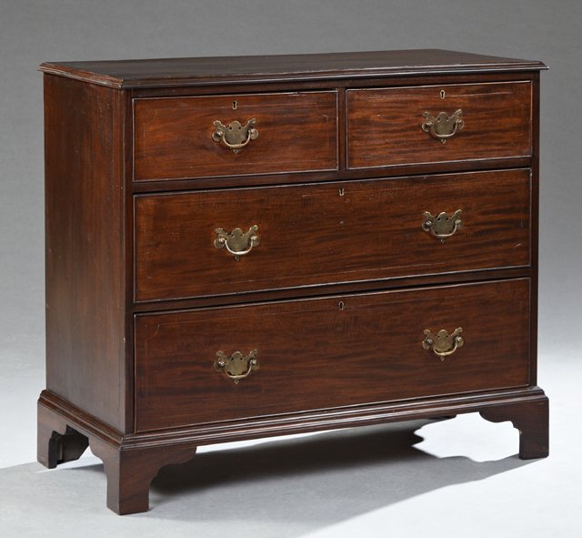 George III Style Carved Mahogany Chest, 19th c., the: George III Style Carved Mahogany Chest, 19th c., the stepped rectangular top over two frieze drawers above two graduated drawers, on ogee bracket feet, H.- 35 1/4 in., W.- 40 1/2 in., D.- 18 1/2 in.