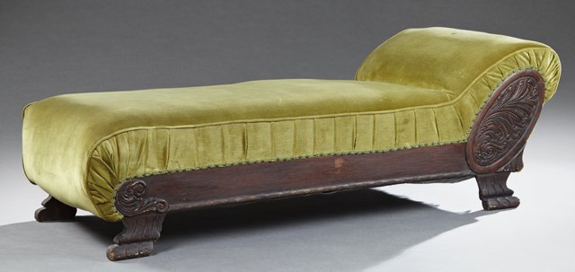American Victorian Carved Oak Fainting Couch, late 19th: American Victorian Carved Oak Fainting Couch, late 19th c., with a rolled headrest over an acanthus carved medallion, on paw feet, in green velvet upholstery, H.- 25 in., W.- 76 in., D.- 31 in.