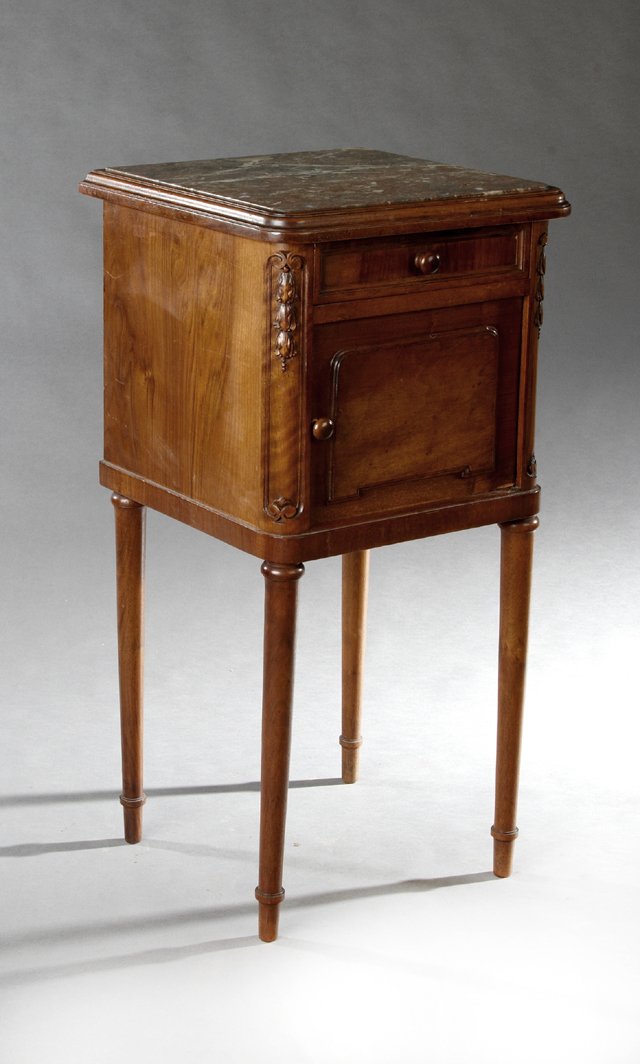 French Louis XVI Style Carved Walnut Marble Top: French Louis XVI Style Carved Walnut Marble Top Nightstand, 20th c., the curved corner inset highly figured rouge marble over a frieze drawer above a cupboard door, on ring turned tapered legs to Fren