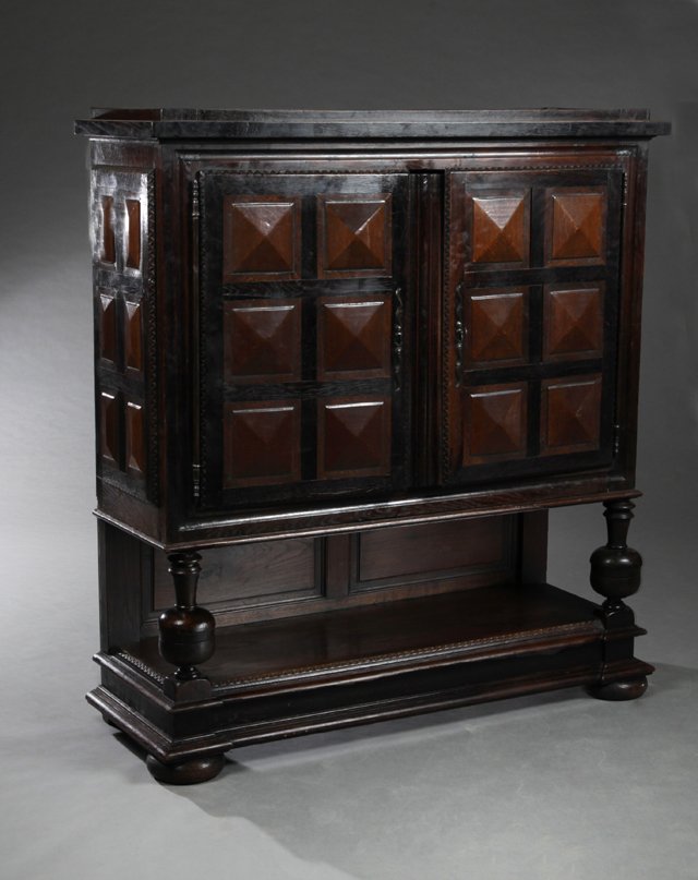 French Louis XIII Style Carved Oak Court Cupboard, 19th: French Louis XIII Style Carved Oak Court Cupboard, 19th c., the stepped top over two relief diamond carved cupboard doors with long iron escutcheons and long iron fiche hinges, on baluster turned supp
