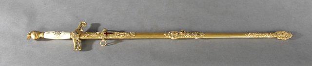 Knights Templar Brass and Enamel Sword and Scabbard, c.: Knights Templar Brass and Enamel Sword and Scabbard, c. 1900, the damascened blade engraved "Chas. A. Muffett," by the K.C. Lilley Co., Columbus, Ohio, with a bone handle, H.- 35 5/8 in., W.- 5 3/8 in