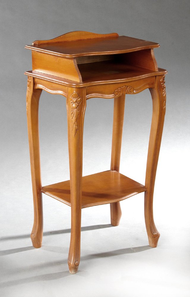 French Louis XV Style Carved Cherry Bowfront Telephone: French Louis XV Style Carved Cherry Bowfront Telephone Stand, 20th c., the serpentine arched back over a shelf above a stepped open shelf on floral carved cabriole legs to scrolled feet on French toes