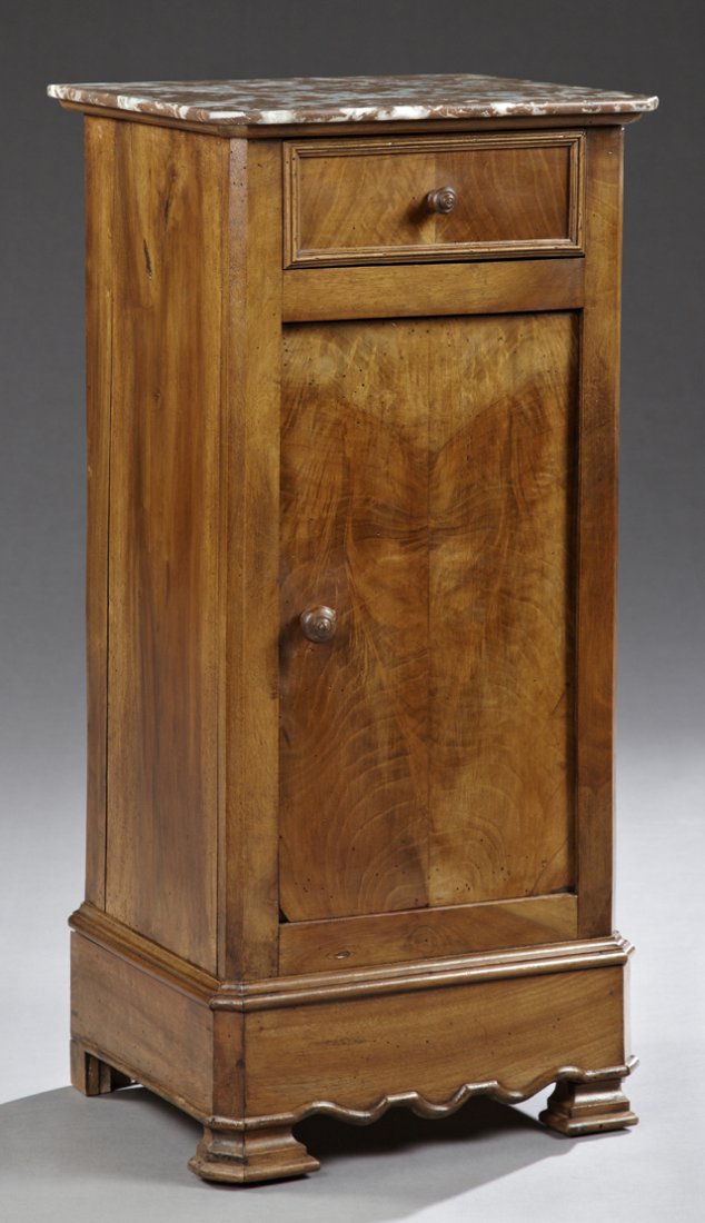 French Louis Philippe Carved Walnut Marble Top: French Louis Philippe Carved Walnut Marble Top Nightstand, 19th c., the canted corner highly figured rouge marble over a frieze drawer above a cupboard door, on a plinth base on stepped feet, H.- 32 i
