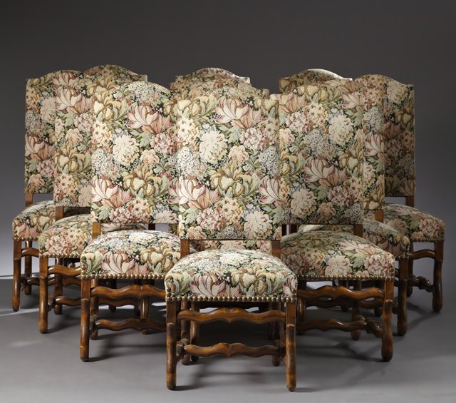 Set of Twelve Louis XIII Style Carved Birch Dining: Set of Twelve Louis XIII Style Carved Birch Dining Chairs, 20th c., the arched backs over trapezoidal seats on serpentine carved legs joined by serpentine H-form stretchers, H.- 43 3/4 in., W.- 19 1/2