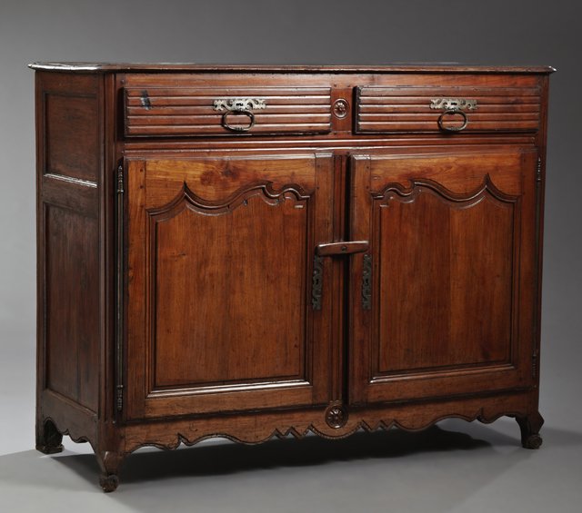 French Provincial Louis XV Style Carved Cherry: French Provincial Louis XV Style Carved Cherry Sideboard, c. 1830, the rectangular top over two reeded frieze drawers above two fielded panel cupboard doors with long iron escutcheons and long iron fi