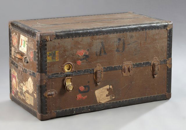 American Iron Brass and Leather Travel Trunk, c. 1927,: American Iron Brass and Leather Travel Trunk, c. 1927, Philadelphia, by the Belber Trunk and Bag Co., the leather strap handle over an interior fitted with hat storage over three graduated drawers fla