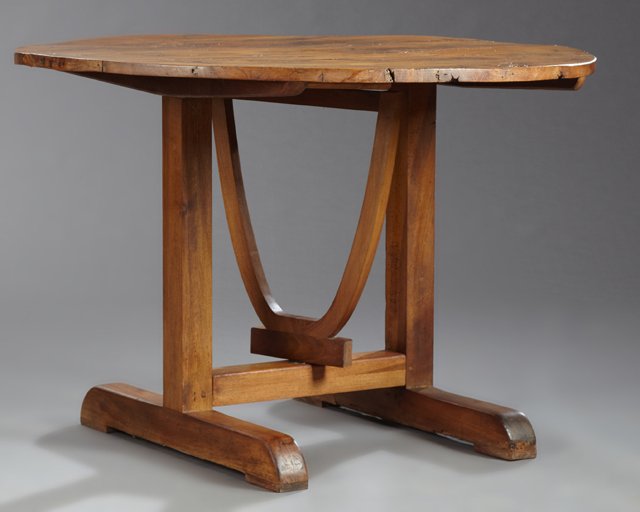 French Provincial Carved Elm Wine Tasting Table, 19th: French Provincial Carved Elm Wine Tasting Table, 19th c., the circular top tilting on a trestle base on splayed legs, H.- 49 in., Dia.- 41 in.