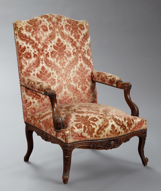 Louis XV Style Carved Beech Fauteuil, late 19th c., the: Louis XV Style Carved Beech Fauteuil, late 19th c., the arched rectangular back over a bowed seat within upholstered arms on cabriole supports to cabriole carved legs with scrolled feet, joined by a s