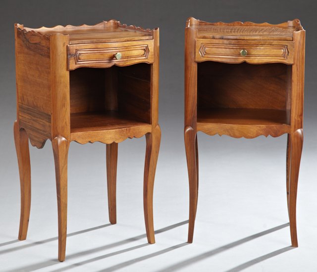 Pair of French Louis XV Style Carved Walnut: Pair of French Louis XV Style Carved Walnut Nightstands, 20th c., the three-quarter galleried tops over bombe frieze drawers above open shelves on cabriole legs joined by arched serpentine skirts, H.-