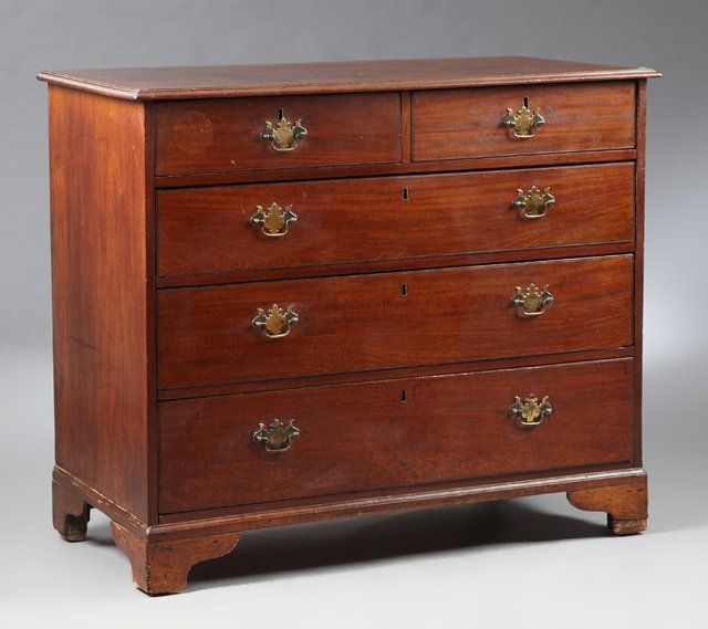 English George III Carved Mahogany Chest, 19th c., the: English George III Carved Mahogany Chest, 19th c., the rectangular top over two frieze drawers above three long graduated drawers, on ogee bracket feet, H.- 37 1/2 in., W.- 44 in., D.- 21 1/2 in.