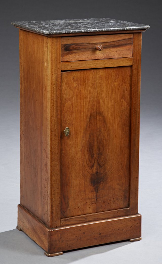 French Louis Philippe Carved Walnut Marble Top: French Louis Philippe Carved Walnut Marble Top Nightstand, 19th c., the rectangular highly figured black marble over a frieze drawer above a cupboard door on a plinth base, H.- 29 3/8 in., W.- 15 in.,