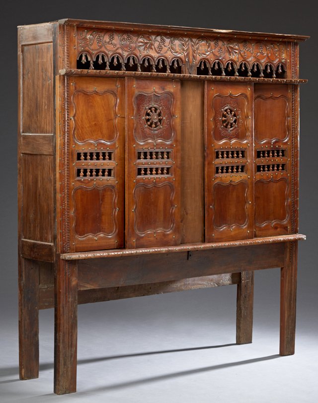 French Carved Cherry Lit Clos, 19th c., Brittany, the: French Carved Cherry Lit Clos, 19th c., Brittany, the stepped crown over a pierced spindled gallery, above two central spindled sliding doors, flanked by two hinged paneled doors with double central r