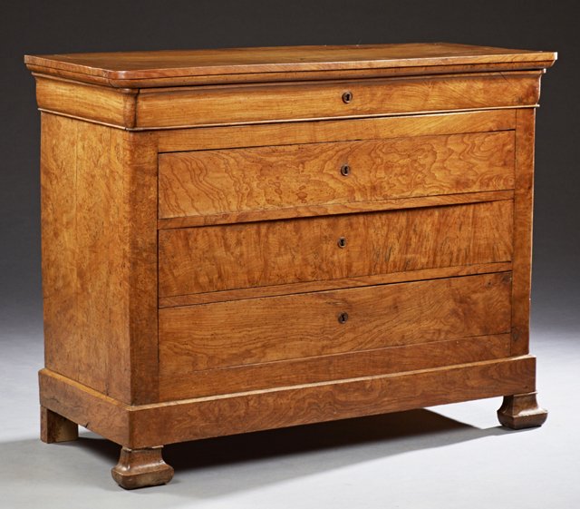 French Louis Philippe Carved Elm Commode, 19th c., the: French Louis Philippe Carved Elm Commode, 19th c., the carved corner top over a cavetto drawer and three lower drawers, on a plinth base, on ogee block feet, H.- 39 1/2 in., W.- 51 1/4 in., D.- 21 3/8