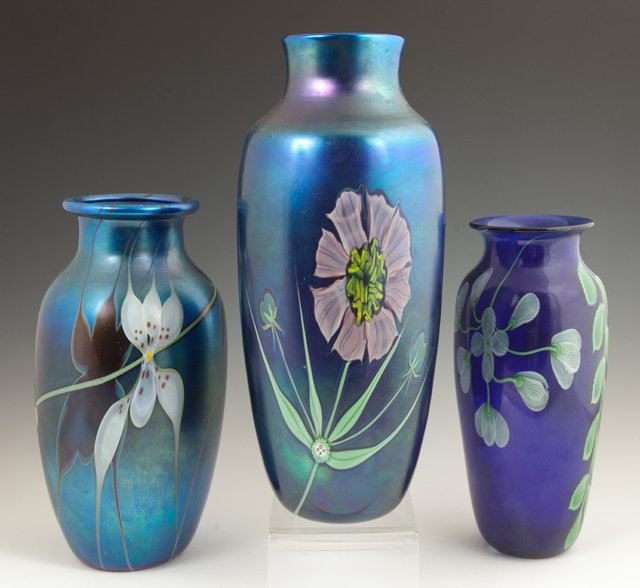 Three Orient and Flume Art Glass Baluster Vases, 20th: Three Orient and Flume Art Glass Baluster Vases, 20th c., one iridescent with floral decoration, signed P. Beyers; one of clear blue with floral decoration, 1984, signed Siders; the third of iridescen