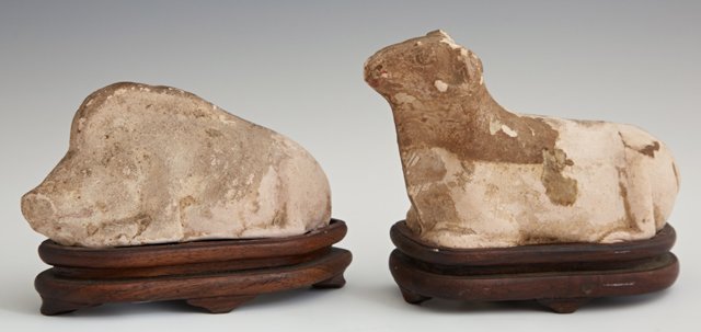 Ancient Byzantine Clay Ram and Hog, on carved wooden: Ancient Byzantine Clay Ram and Hog, on carved wooden bases, the hog with a Sotheby's Chicago label, Ram- H.- 3 1/4 in., W.- 5 1/2 in., D.- 2 1/8 in.