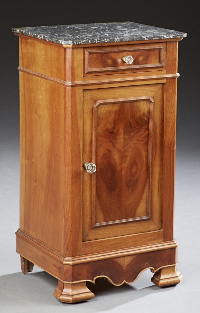 French Louis Philippe Carved Cherry Marble Top: French Louis Philippe Carved Cherry Marble Top Nightstand, 19th c., the canted corner highly figured gray marble over a frieze drawer and a cupboard on a plinth base on ogee block feet, joined by a se