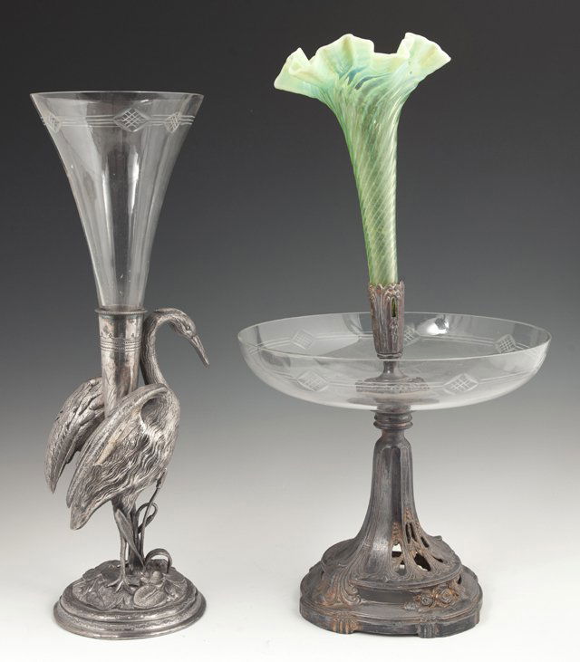 Two French Silverplated Spelter Epergnes, 19th c., one: Two French Silverplated Spelter Epergnes, 19th c., one of crane form with an etched glass trumpet vase; and one with an etched center bowl and a green art glass trumpet vase, Green- H.- 16 1/2 in., Di