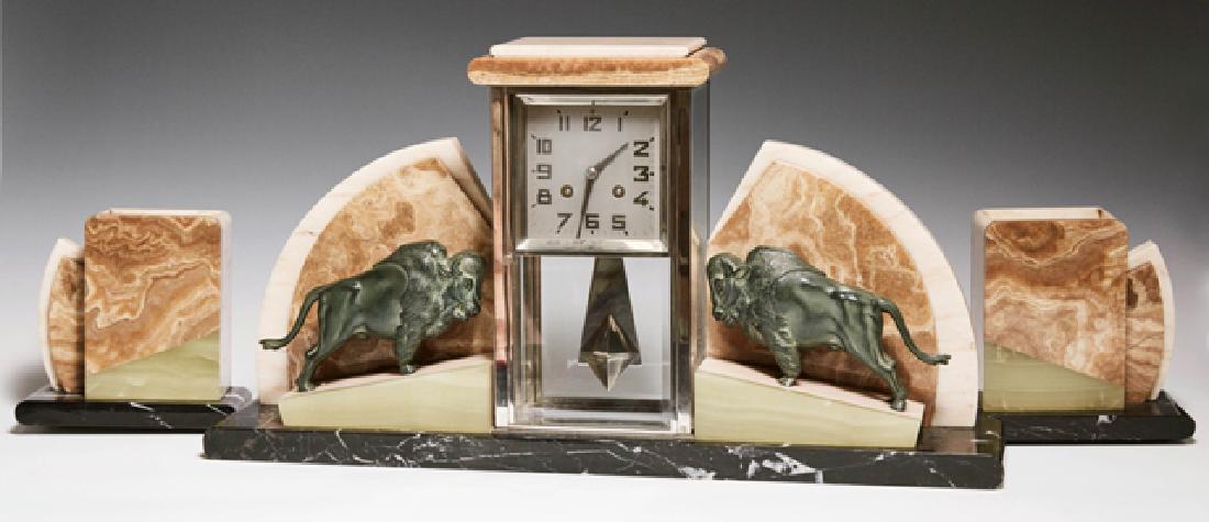 French Three Piece Art Deco Marble, Alabaster and Onyx: French Three Piece Art Deco Marble, Alabaster and Onyx Clock Set, c. 1940, with a central geometric rectangular beveled glass chrome mounted time and strike clock, flanked by inclined onyx and creme m