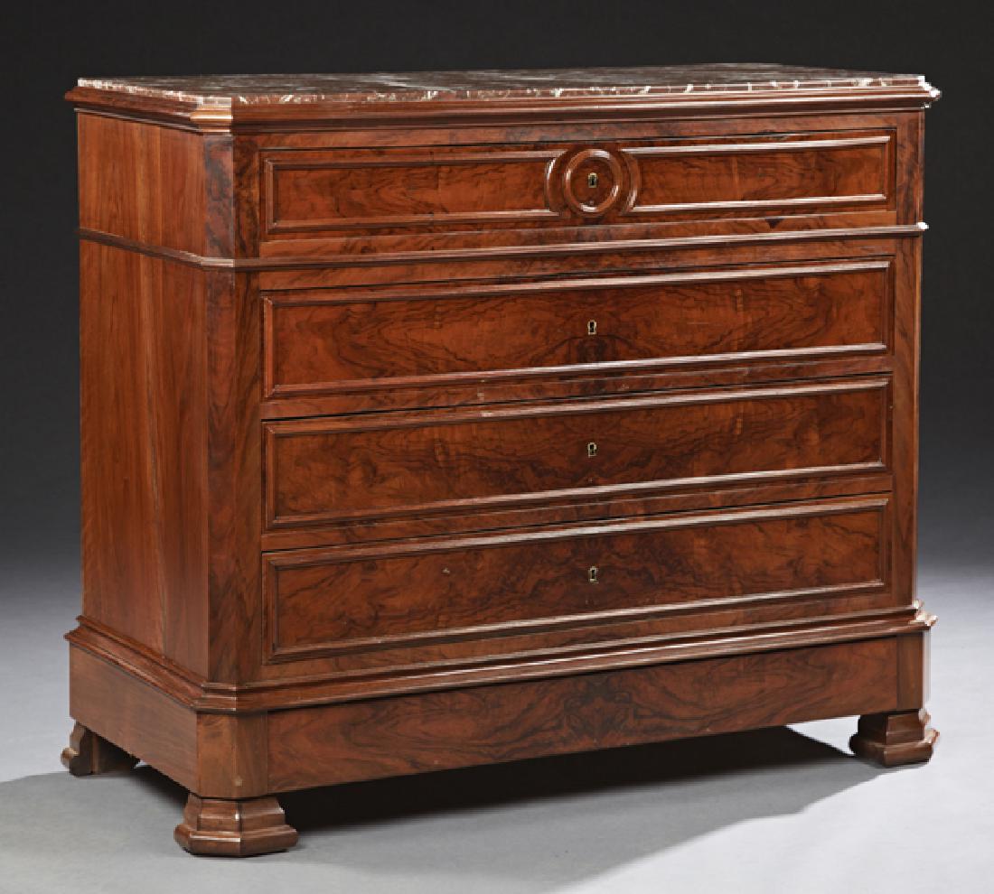 French Louis Philippe Carved Walnut Marble Top Commode,: French Louis Philippe Carved Walnut Marble Top Commode, 19th c., the inset canted corner highly figured rouge marble over a frieze drawer, three deep drawers and a bottom "secret" drawer, on stepped b