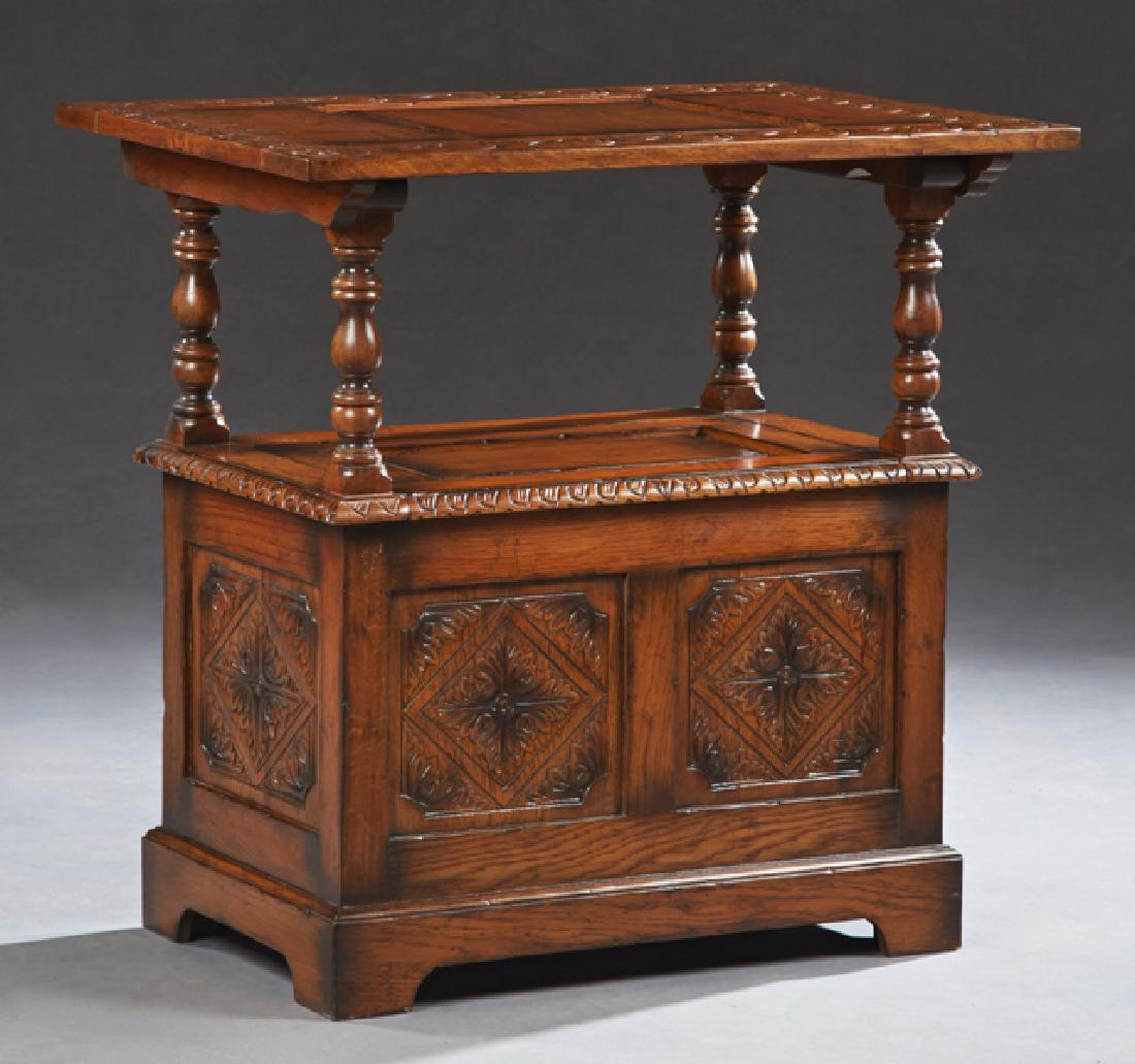 English Carved Oak Monk's Bench Table, late 19th c.,: English Carved Oak Monk's Bench Table, late 19th c., the fielded panel top with an incised border, lifting to form the back of the bench, the hinged seat opening to storage, the back of the bench fron
