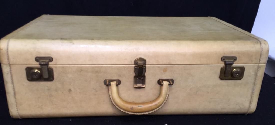 Vintage Lido New York Luggage Vintage Lido luggage,: Vintage Lido luggage, hard exterior pale yellow leather with leather handle. Rose colored lined interior. Suitcase measures 9 inches H x 25 inches W x 16 inches D. Condition consistent with age. Yale 