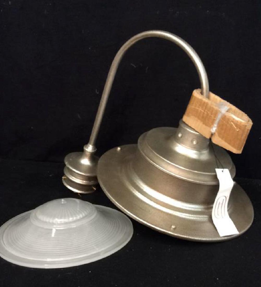 New Troy Lighting Aluminum Light post Fixture New from: New from box labeled Troy lighting, California, south street Post Down light, includes light and glass dome. Measures app 14 inches diameter with arm 20 inches ht of arm 17 inches. Came from original 