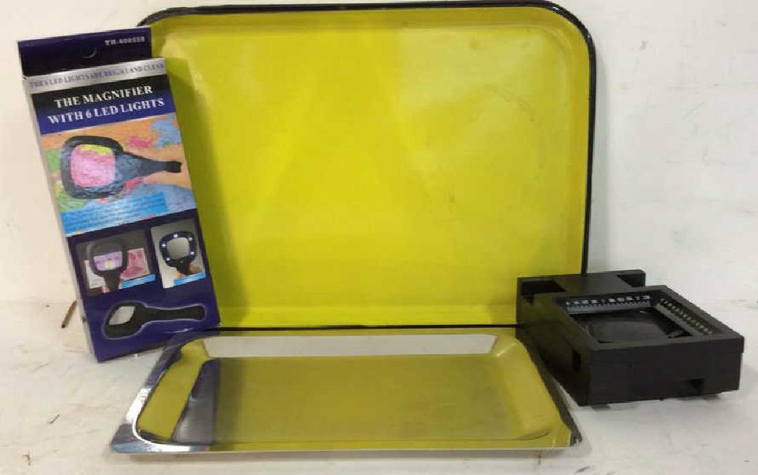 2 Trays and magnifiers Two magnifying glasses one in: Two magnifying glasses one in box, one yellow enamel tray measures 12 by 9 inches and one chrome tray