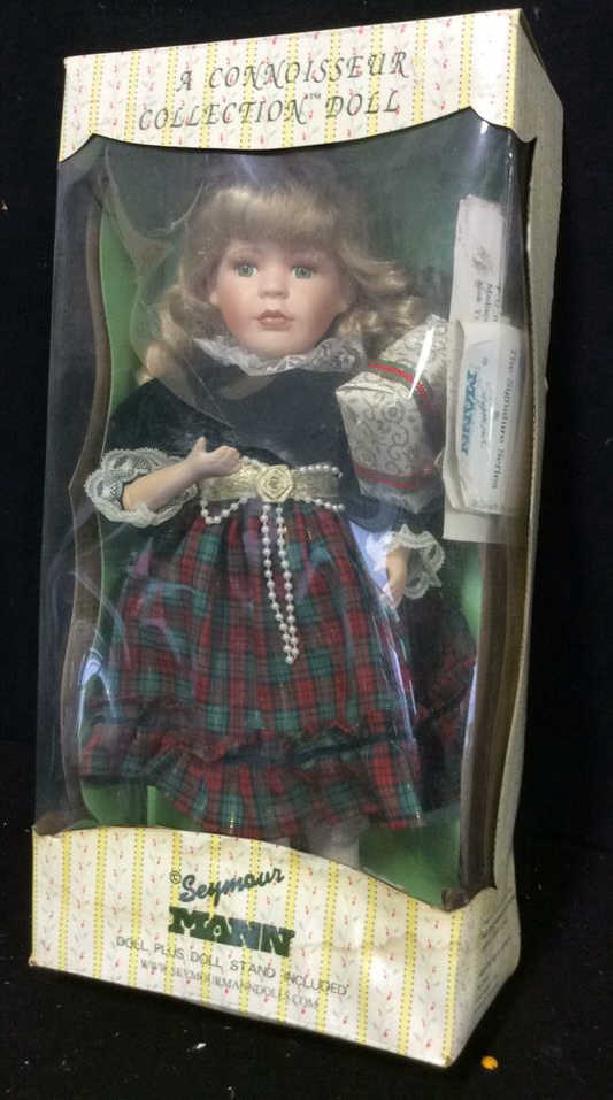 Seymour Mann Collectible Porcelain Doll w Box Hand: Hand painted Porcelain Doll with hand finished costume. Original box labeled for Seymour Mann, a Connoisseur Collection Doll. Box height 19 inches. With paperwork