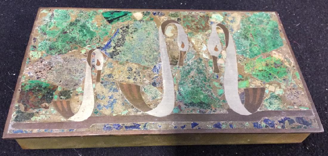 Vintage Brass Inlaid Box: Unique brass box with hinged inlaid cover depicting 3 swans. Blue and green inlay. Box lined with wood. Collectible tabletop keepsake piece. Measures approx 1 inch H x 7.5 inches W x 4 inches D. Made 
