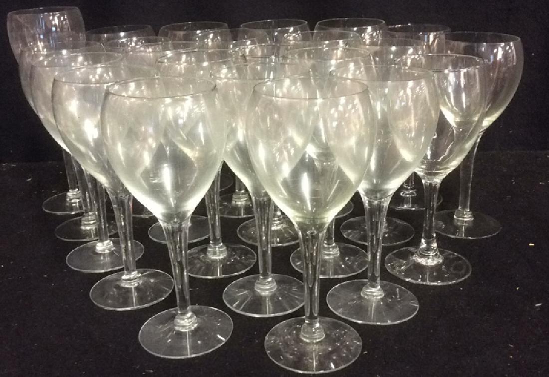 Lot of 22 White Wine Glasses: 22 white wine glasses; majority measuring approx 6 3/4 inches tall with approx 2 3/4 inch diameter rim and approx 2 3/4 inch diameter base. Wine glasses Stemware Tableware