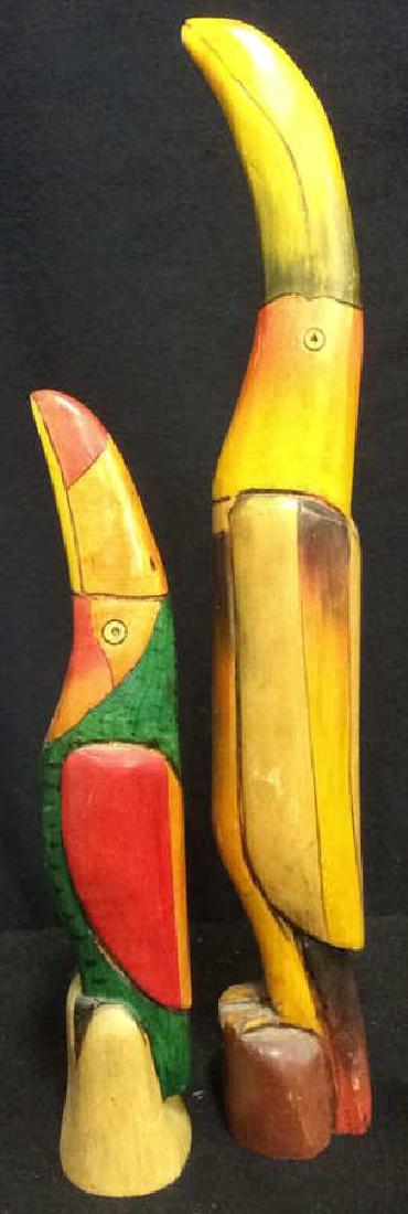 Two Carved Wood Hand Painted Toucan Sculptures: Group of Two wood, hand painted Toucan Form Sculptures. Tallest measures approx 23 inches tall and approx 3 inches wide. Bird Sculptures Toucan Wood Carved Hand Painted Collectible