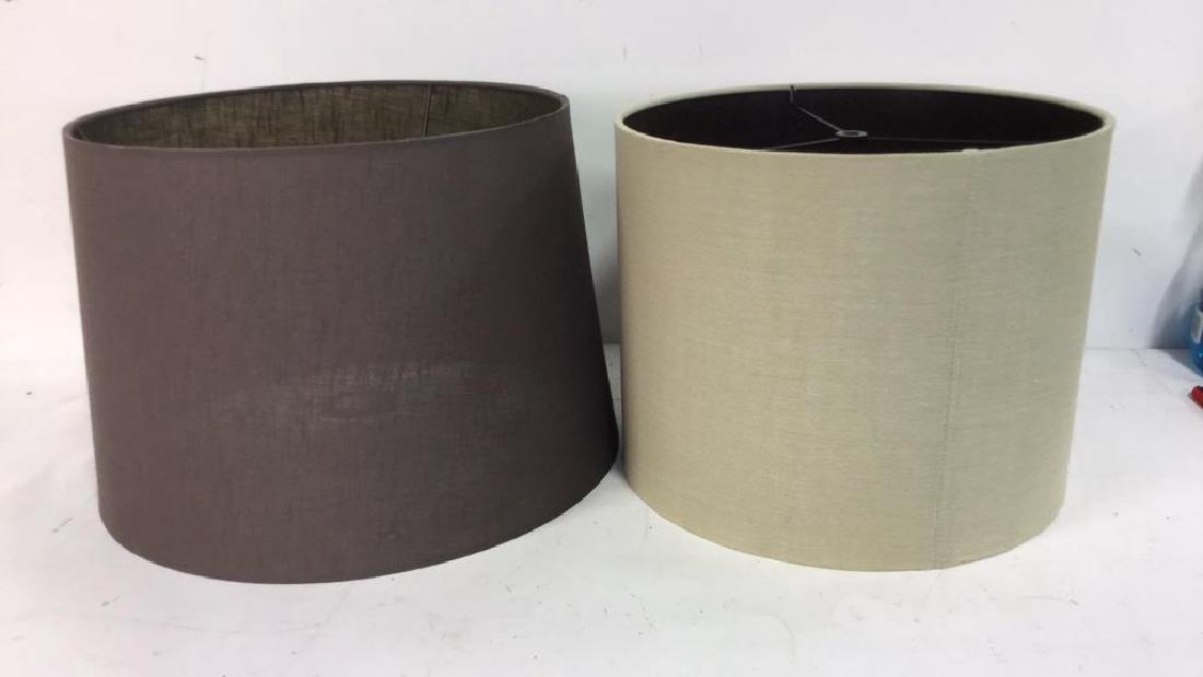 Group Lot Lamp Shades in Brown Tones: Group Lot of 2 Lamp Shades in Brown Tone, both circular; darker brown shade measures approx 14 inches diameter at top rim and 16 inches diameter at lower rim and 11 inches high. Lighting Lamp Shades
