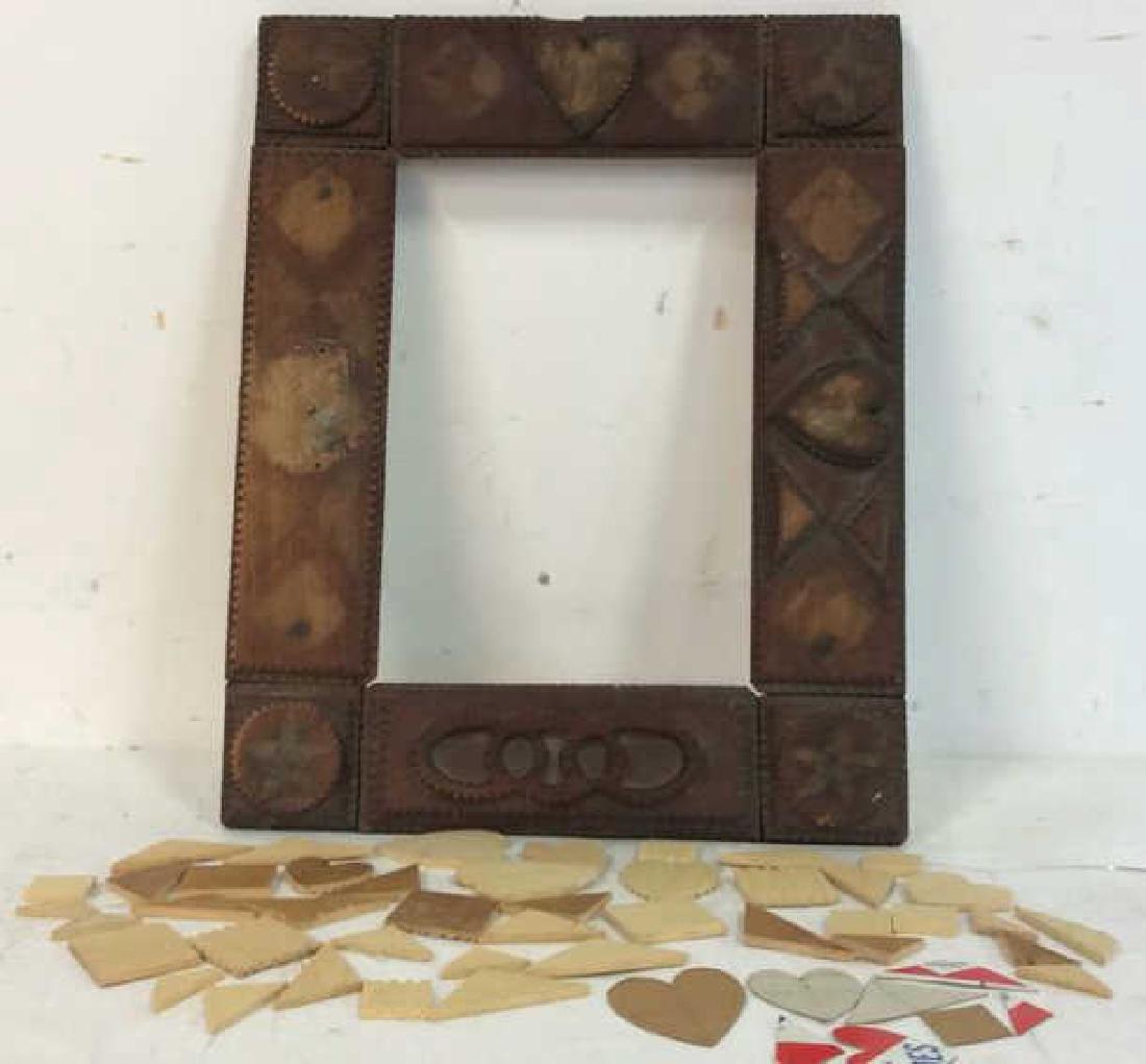 Tramp Art Frame with Additional Pieces: Tramp Art, folk art, hand made frame with additional pieces of stars, triangles, squares, hearts and more. Missing some pieces . Measures 12 by 15 inches. Additional pieces in canister. Folk art craft