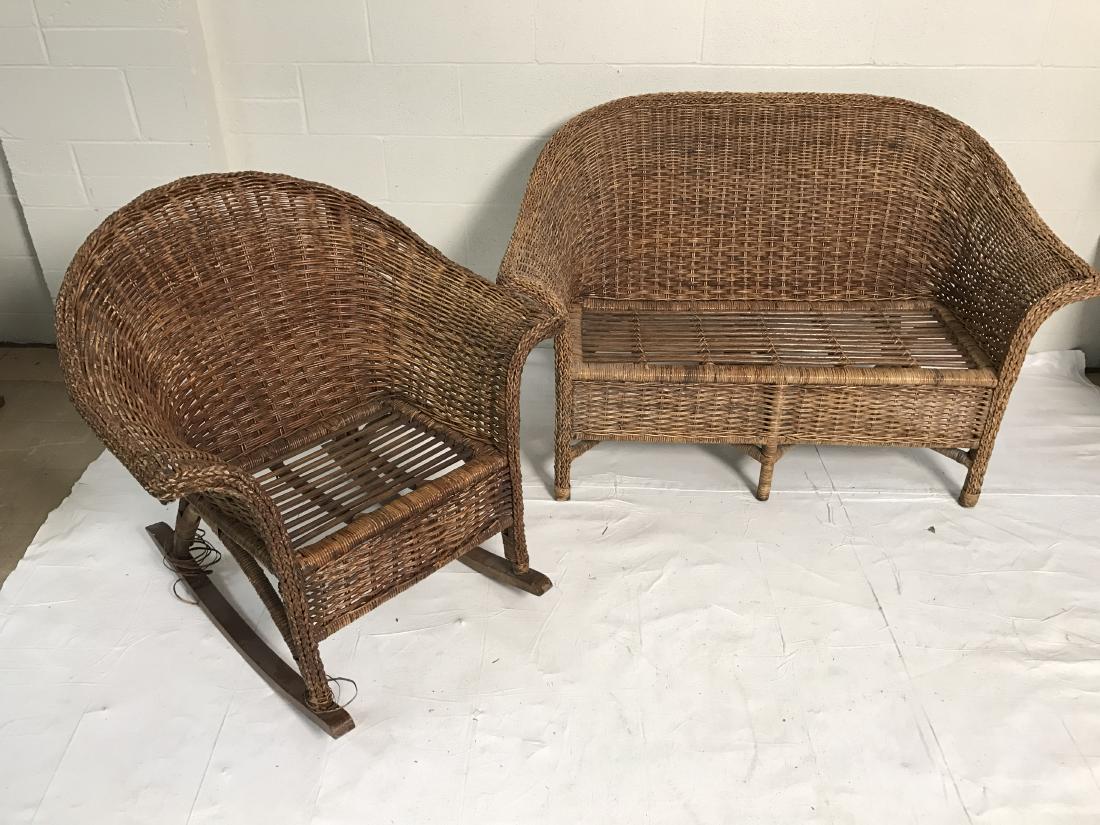 Wicker loveseat and rocking chair: Wicker loveseat and rocking chair. Of recent manufacture. Loveseat has beige cushion with neutral floral print. Cushion in good condition- no rips or stains. Rocking chair has one leg unravelling slig