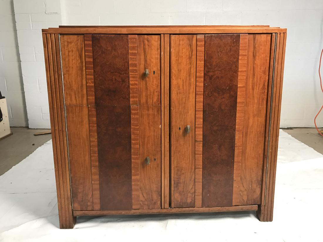 Vintage mid century or art deco cabinet: Vintage mid century or art deco cabinet. Mixed woods. 6 removable shelves inside. Brass hardware. Slight chip on front door. Normal wear and tear commensurate with age. Property of Bedford Estate. 43.