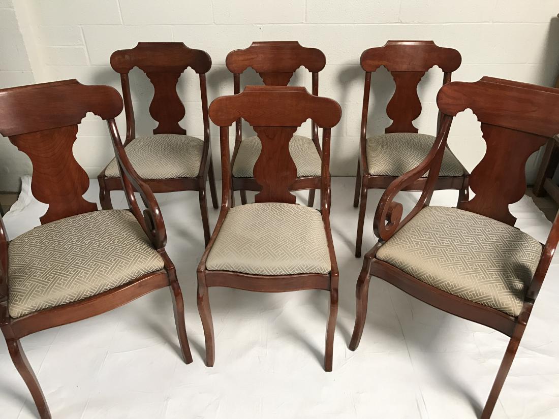 Dining table and chairs: Dining table and 6 chairs. Of recent manufacture. Extendable table with 2 armchairs and 4 side chairs. Dimension of table: 29" H x 40" D. Length without any leaves inserted: 59". Each leaf is 15" W. P