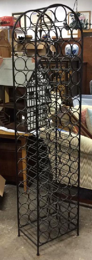 Standing Black Metal Wine Rack: Holds over 60 bottles. Measures 72 by 17 by 13 inches.