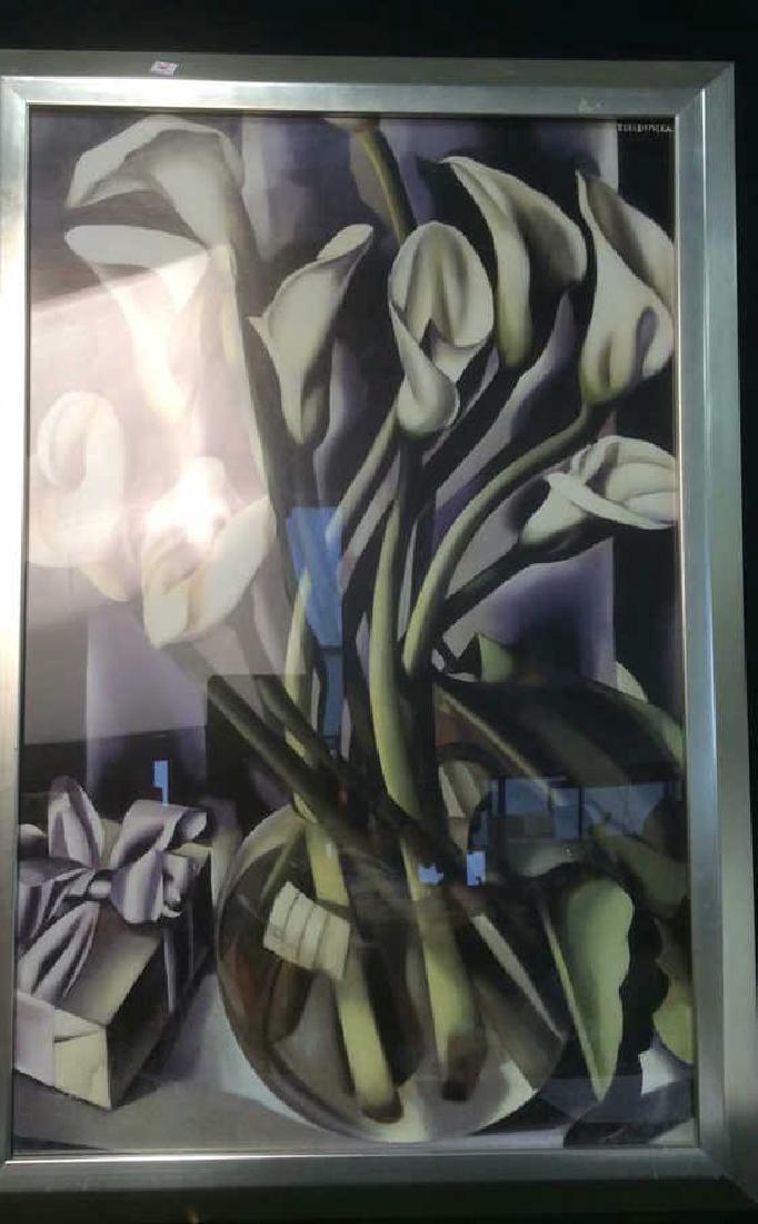 Framed Artwork Calla Lillies By T. de Lempicka: Calla lillies in vase, Art Deco, framed artwork by Tamara de Lempicka. Silver colored frame with some scratches visible. Measures approx 38.5 inches H x 26 inches W. Property of Chappaqua Estate