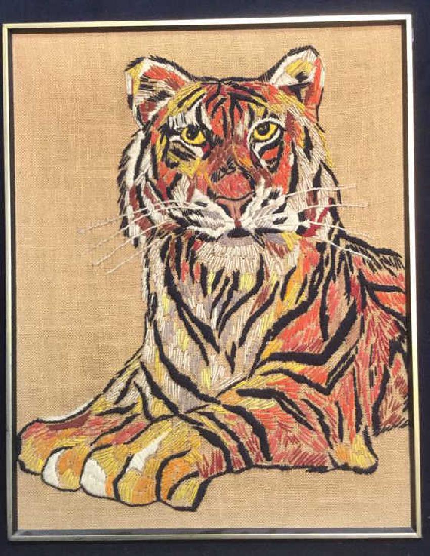 Vintage Needle Craft Depicting Tiger on Burlap: Vintage Hand Needlecraft on Burlap depicting bold tiger pose. Warm reds, yellows, oranges offset by black. Professionally framed. Measures 24 inches by 30 1/2 inches tall.
