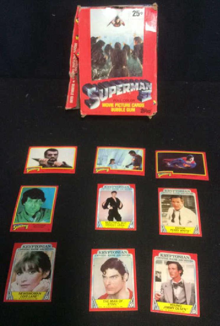 Superman II Movie Picture Cards: Box of Superman II full color movie picture bubble gum cards. Each card has a caption and a scene from the movie. Circa 1980. Most cards still in unopened packages. Over 300 cards.