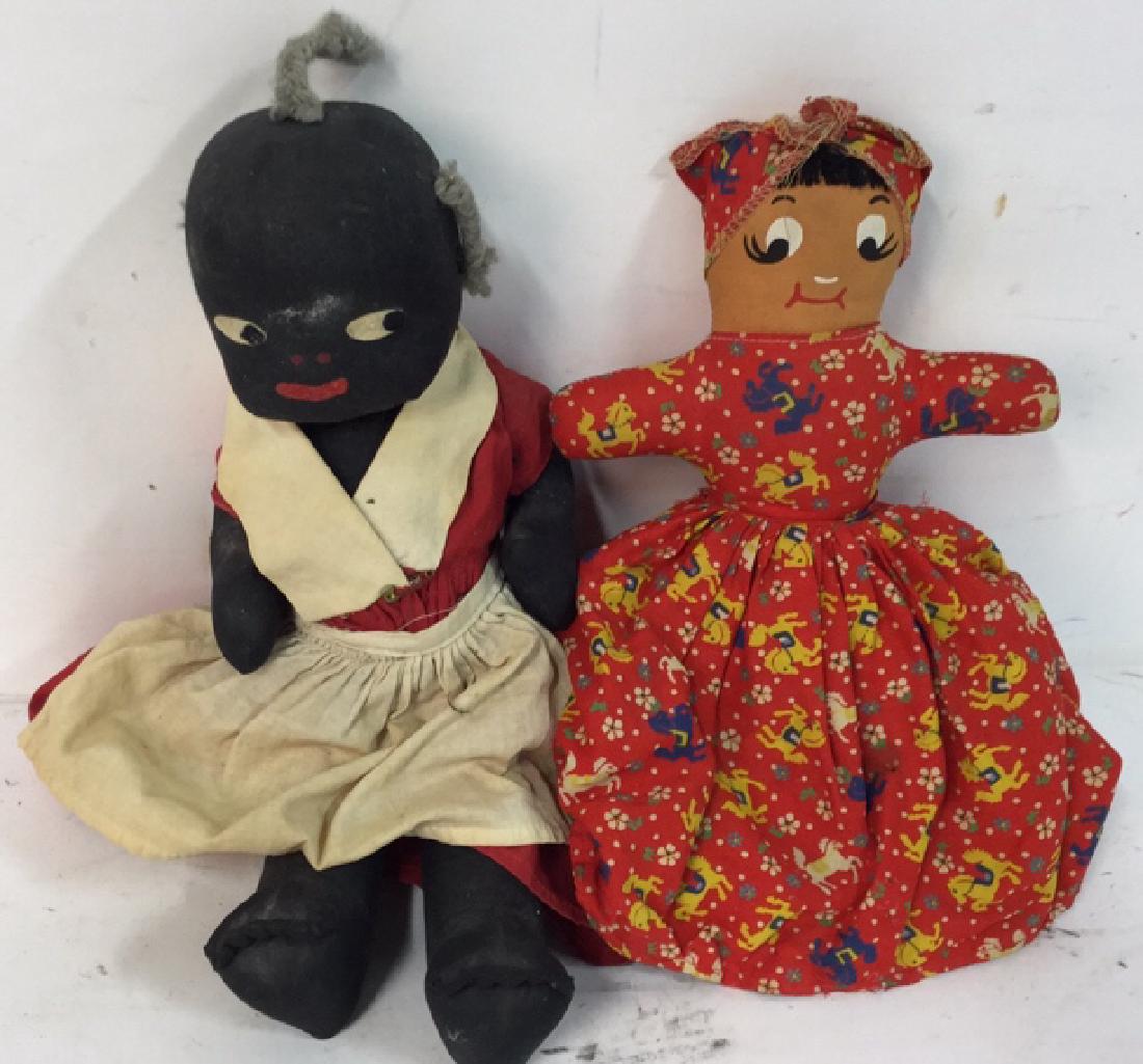 Two Vintage Cloth Dolls: Collectible antique vintage cloth dolls, folk art- 1 Aunt Jemima, mammy, black americana, rag doll missing one pigtail; and 1 topsy-turvy, double-ended black and white doll in red patterned dresses. L