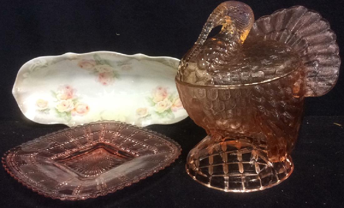 Group Lot 3 Collectible Pink Glass and China Tray: Vintage lot 3 collectible pink glass and china tray; vintage, pink glass, lidded turkey bowl, measuring approx 8 inches tall and approx 8 inches wide; pink square pressed glass plate; floral motif chi